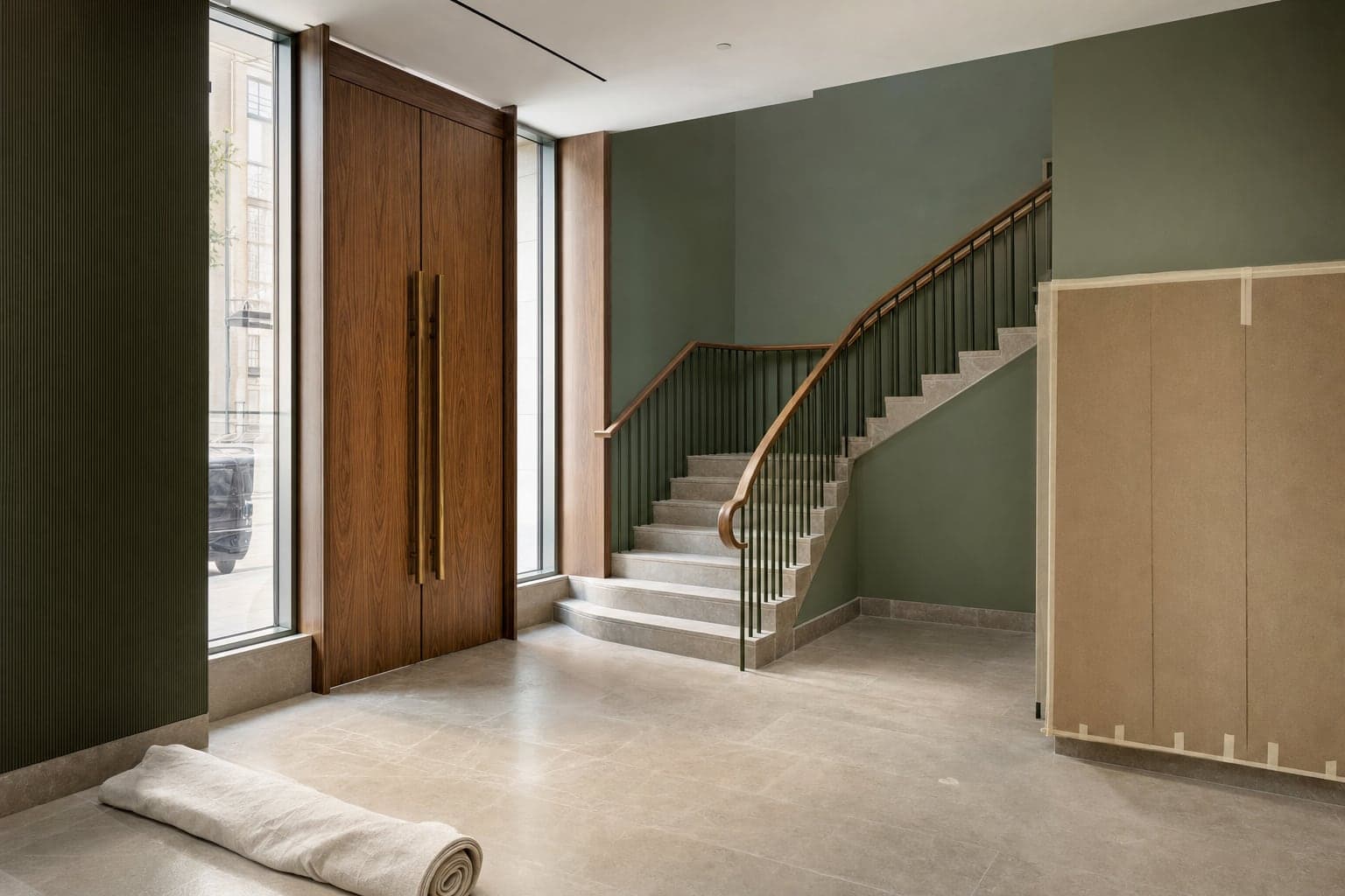 Illustrative commercial interior with timber doors, stone flooring and a finished staircase